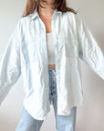 The Cloudy Blue Chambray Button Up (L)
